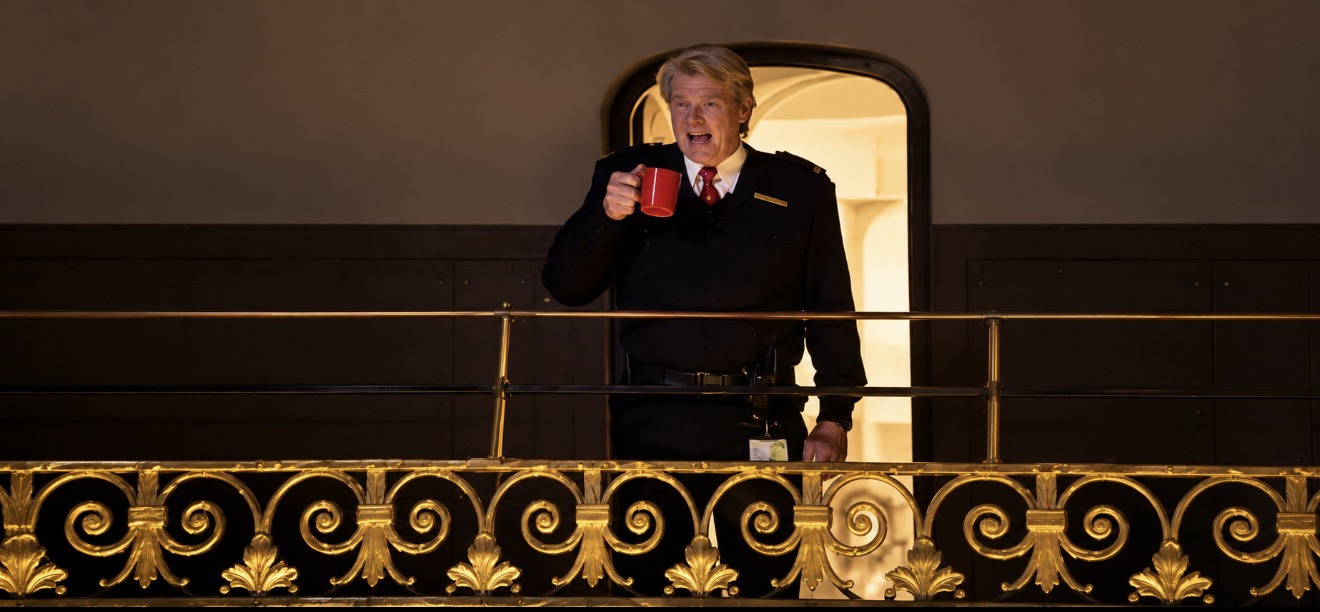 Owner-supplied Paddington 2 photograph of a uniformed man behind ornamental railings