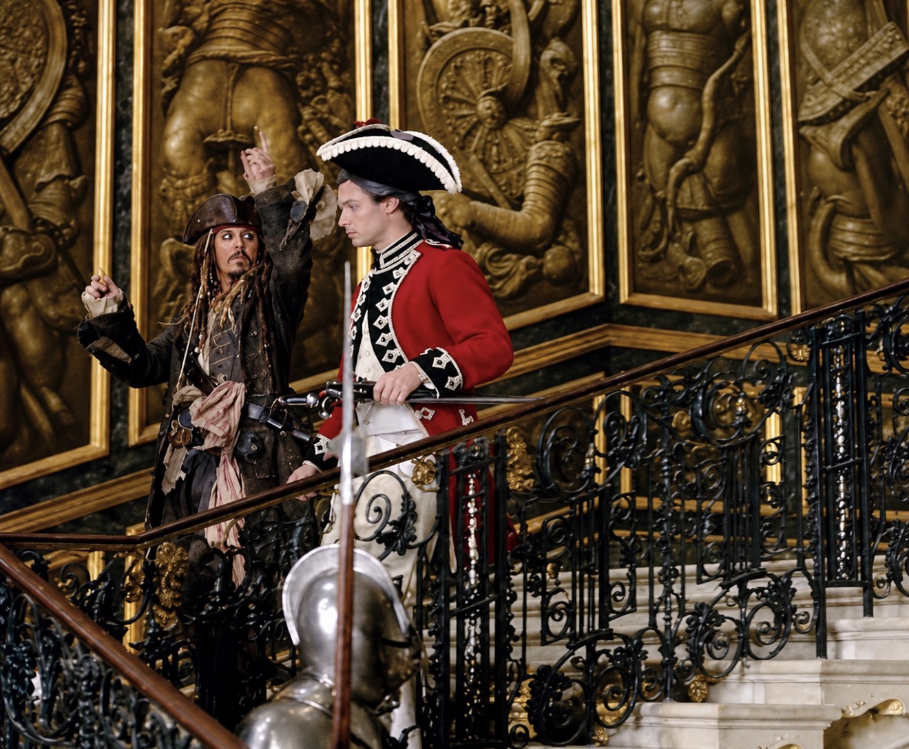 Owner-supplied Pirates of the Caribbean photograph with characters beside ornamental railings