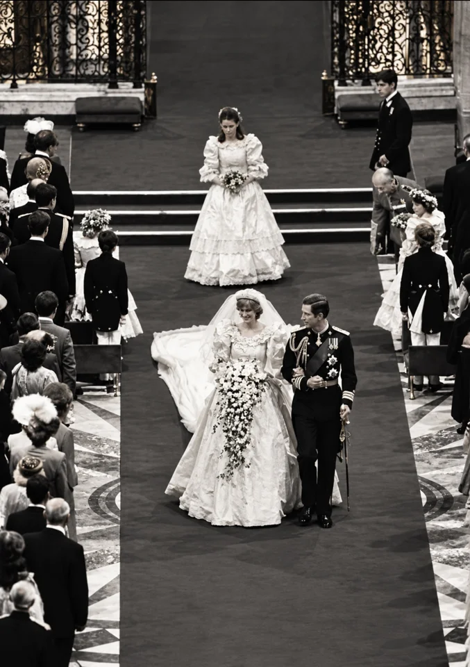 Black-and-white view of Charles and Diana leaving the cathedral ceremony together