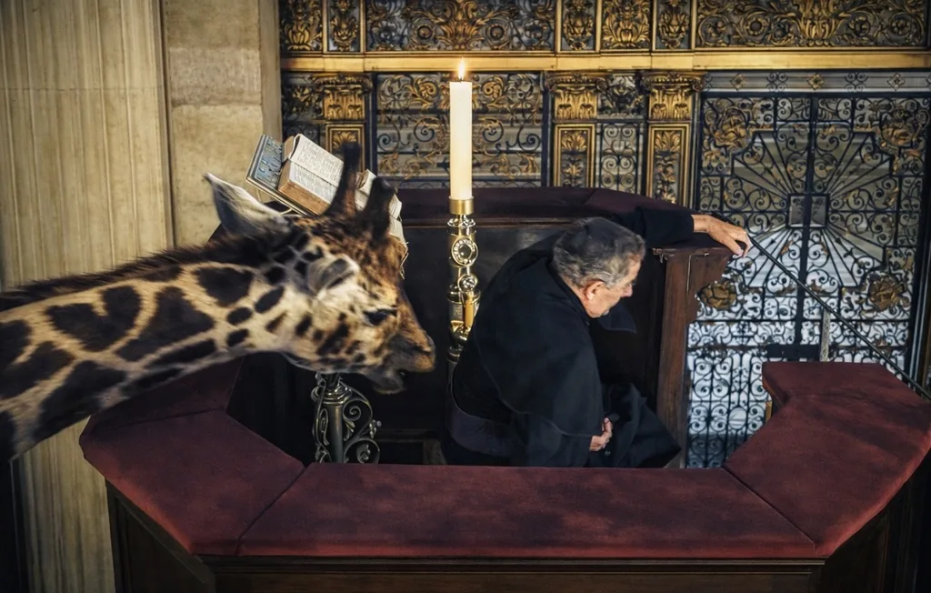 Wonka scene featuring a giraffe beside gilded cathedral ironwork